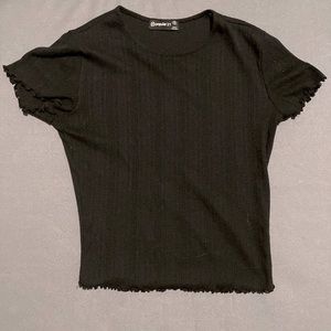 Slightly cropped black top size small